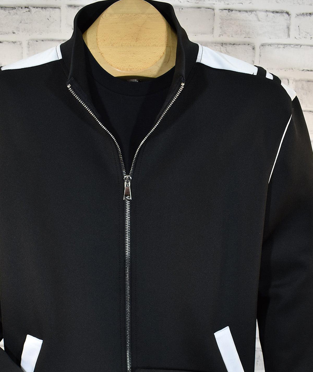 Poly microfiber fabric for comfort and style. Accent white trim on shoulders, armholes and pockets. Classic jacket style with side slash pockets and full zip, great for layering. Pant features a stretch waist band, tie front and classic pockets. Pants feature an open bottom. Made in Italy.