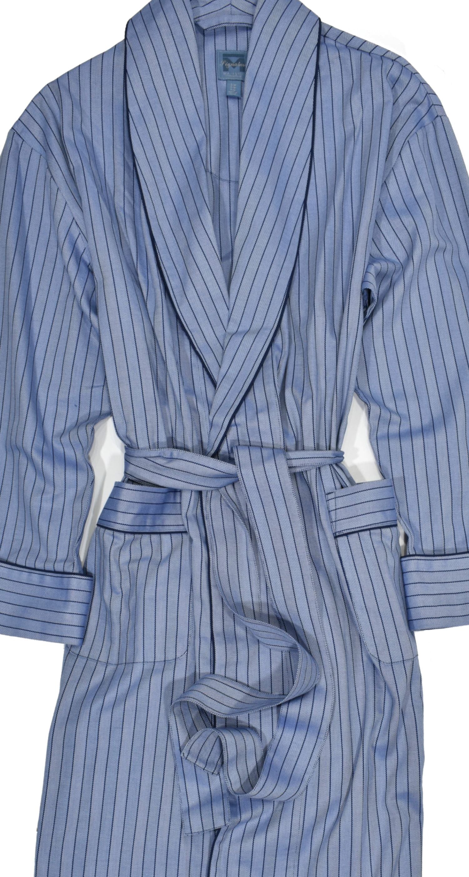 Soft, classic robe model featuring a half inch tonal stripe with the always rich herringbone pattern variated along the stripes. Medium blue base color with navy edge piping on soft cotton fabric. Classic belt closure. Classic front pockets. Classic fit.
