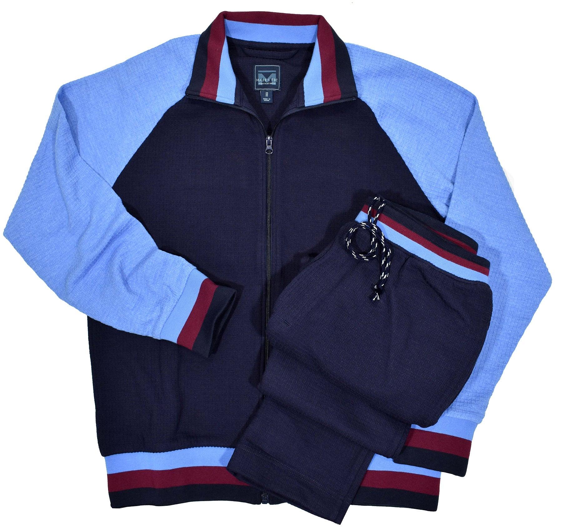 Soft cotton in a waffle weave texture, combining blue colors with a touch of wine accents. Classic cuffs, waist band and side slash pockets on both the top and pant. Cotton waffle weave texture fabric. Draw string pant with elastic waist band. Open bottom pant, approximately 34 length. Classic fit.