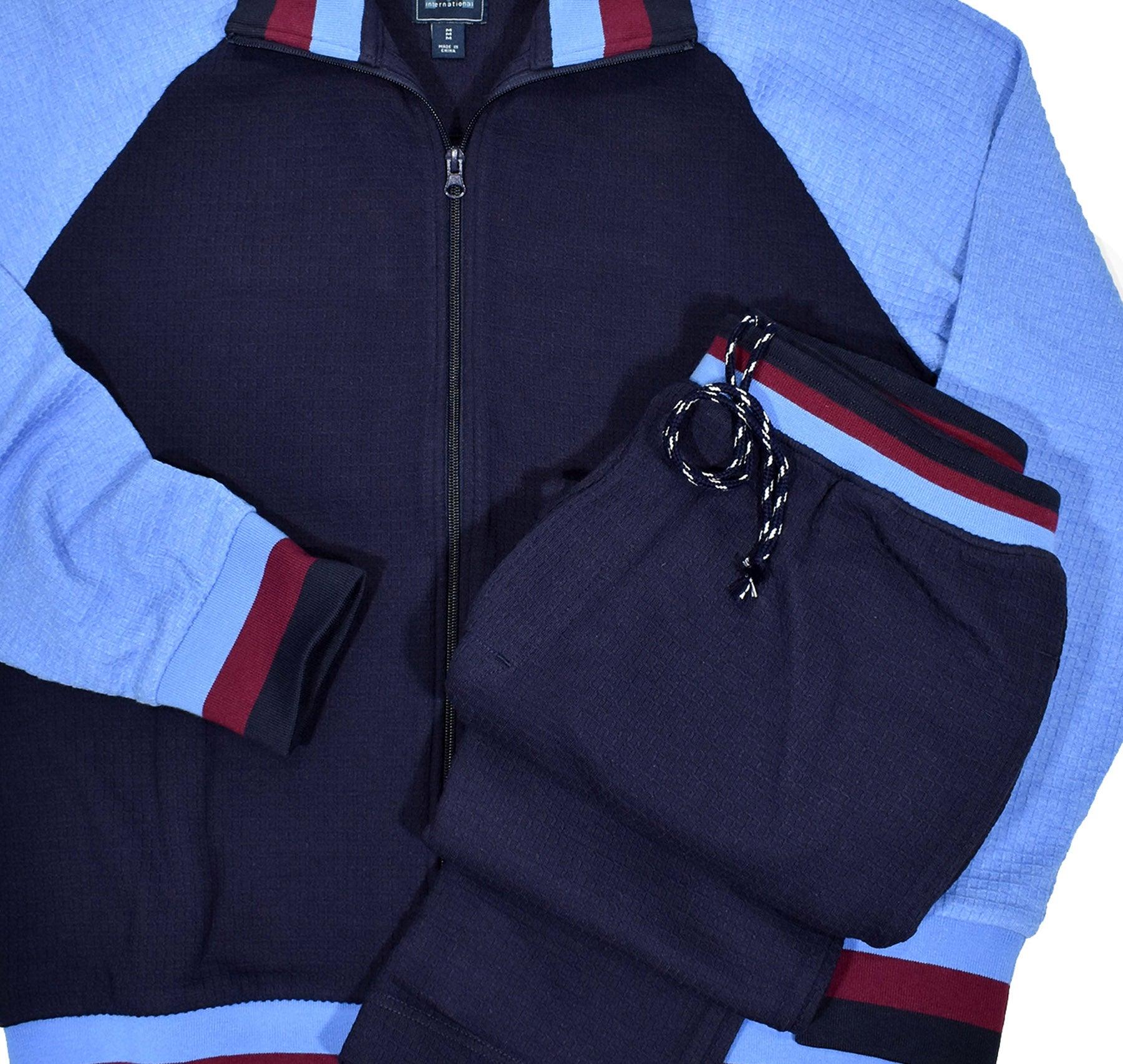 Soft cotton in a waffle weave texture, combining blue colors with a touch of wine accents. Classic cuffs, waist band and side slash pockets on both the top and pant. Cotton waffle weave texture fabric. Draw string pant with elastic waist band. Open bottom pant, approximately 34 length. Classic fit.