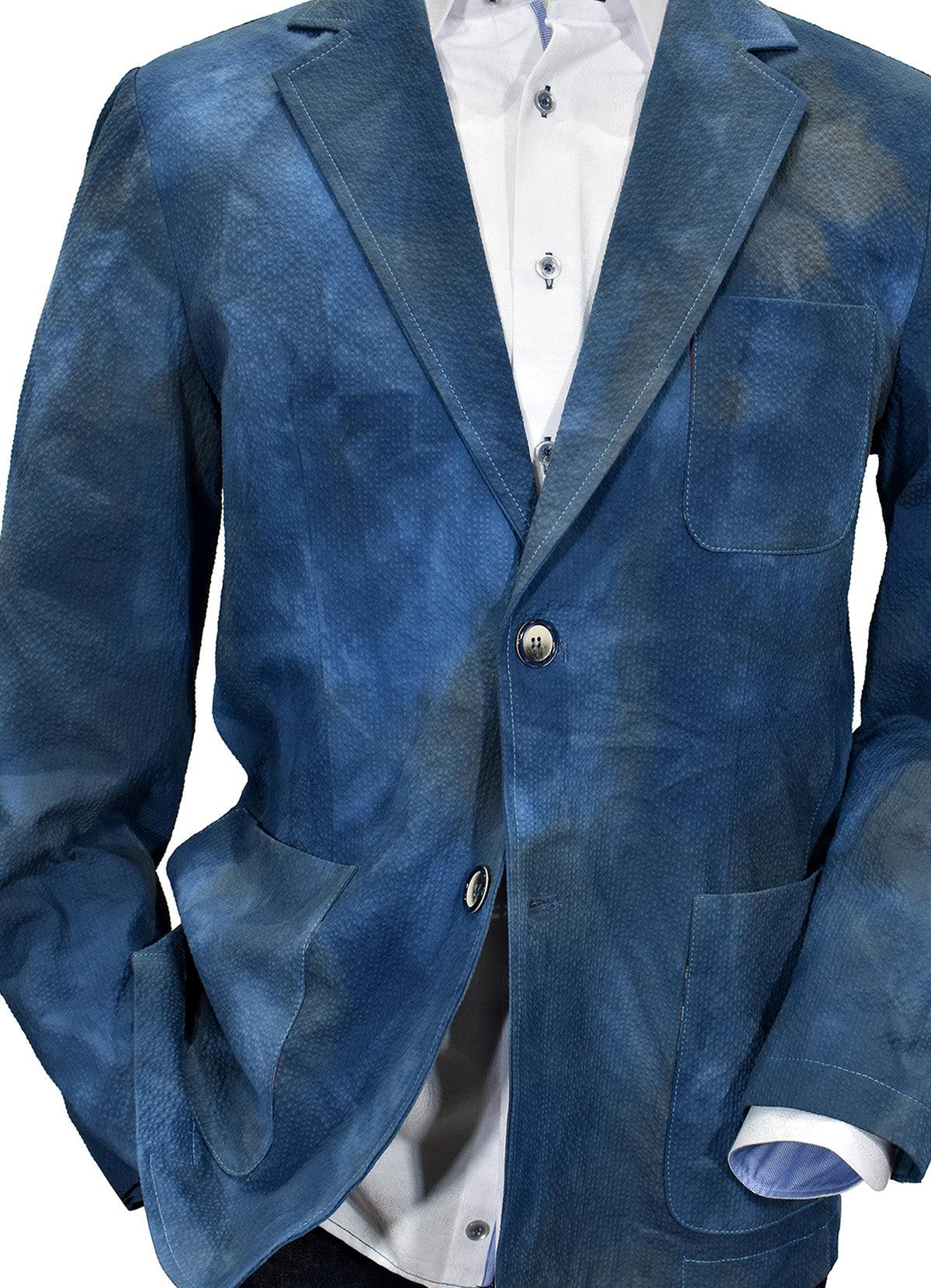 When your image makes a statement, it surely will be when wearing this textured washed and dyed sport coat. Uniquely designed and produced by Graison in Italy featuring a soft shadow seersucker fabric, washed for a distressed, cool image. Graison Graham Inspired Italian Sport Coat Excellent with jeans or pants. Fine textured fabric adds to the image. Nice mix of blue and navy washed colors. Soft coat, should lined. Modern fit, best for a slim to medium build.