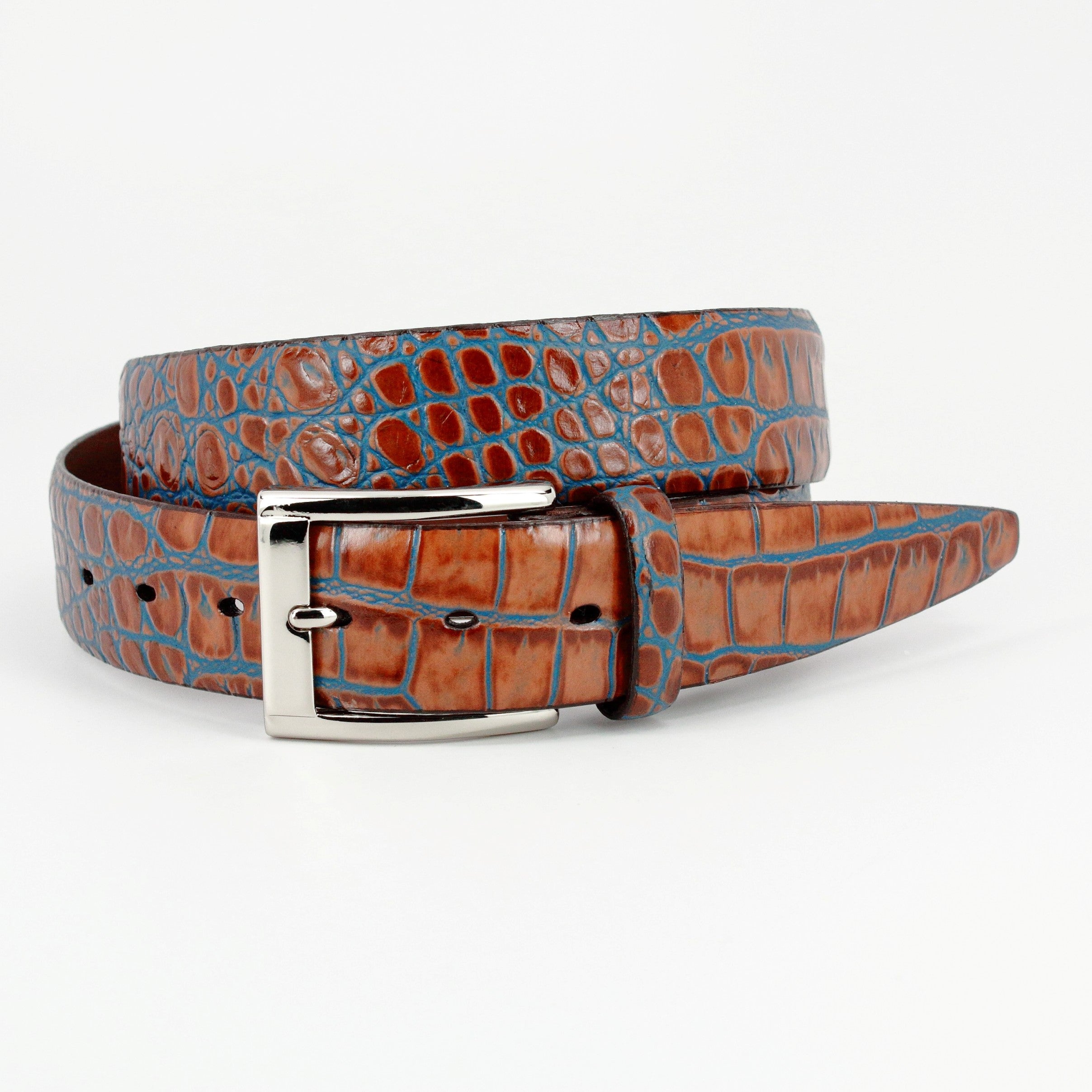 Soft Italian calf leather in chocolate with a staining technique to add teal blue accents.   An outstanding look with any cool jeans.   Classic silver buckle.  35mm or 1 7/16"  Assembled in the USA.
