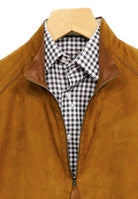 Marcello Sport extra fine suede jacket with clean nappa leather on the reverse side. Accented with nappa leather detailing and fine pic stitching. Outstanding, shirt weight, reversible coat featuring suede outside and leather inside with leather trim detailing on the shoulder and sleeve. Side slash pockets. Open sleeve and open bottom, straight contemporary fit. Colors available: Cognac, Black, Navy, Red, Blue.