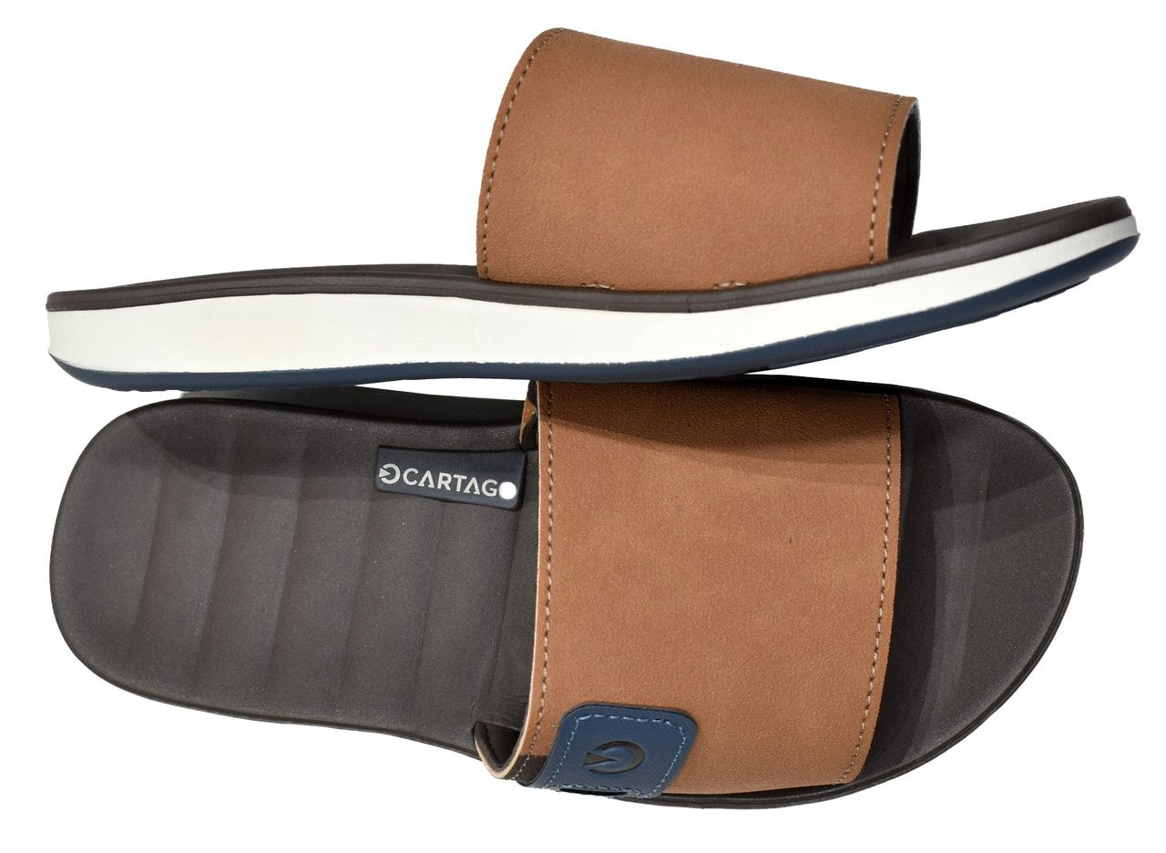 Comfort slides are great updating your Spring/Summer look. Soft cushion foot bed, performance synthetic leather upper and rubber sole. Classic fit