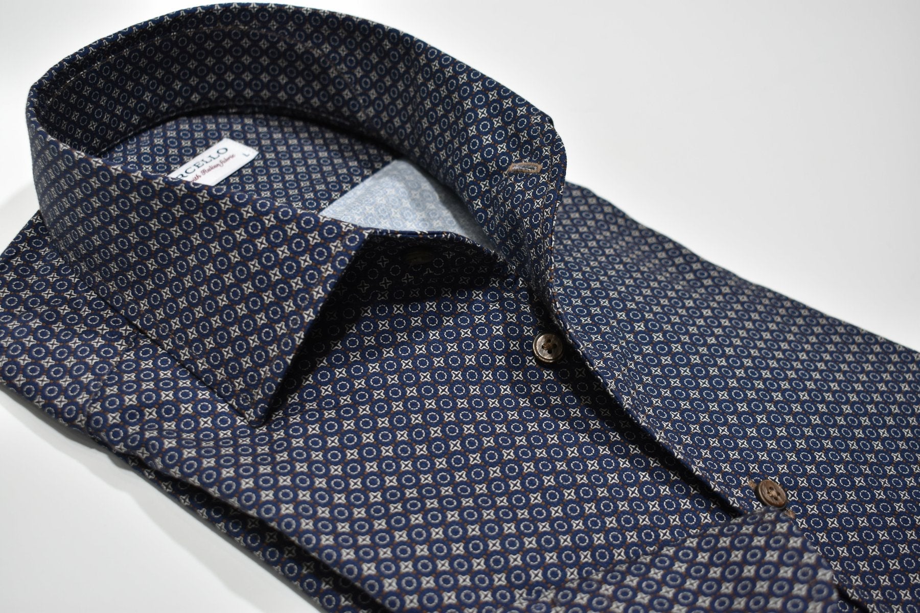 Navy folded shirt with tan design.