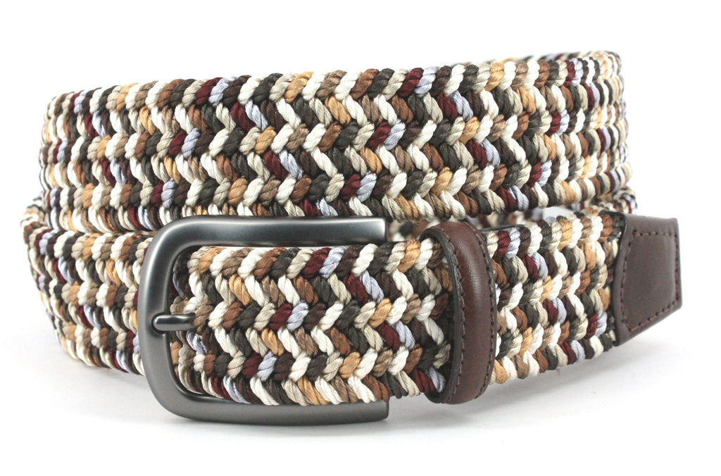 This Italian woven multi-hued belt is an essential for completing any look that requires tan, brown, or neutral bottoms. Crafted with a stretchy cotton base, a brushed buckle, and a leather trim, it's a high-quality piece proudly made in the USA.