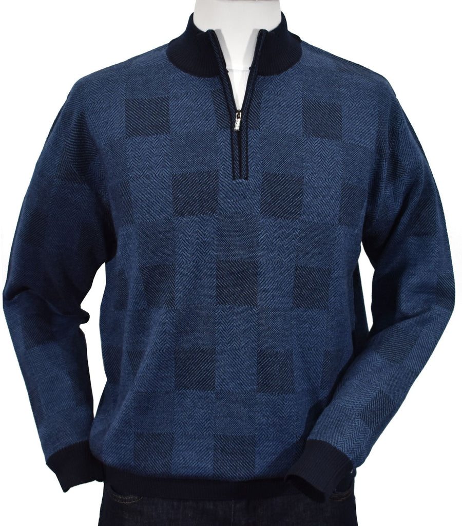 Experience classic elegance and unparalleled comfort with the 874 Hampton Board Sweater, crafted from a luxurious merino blend yarn for a touch of indulgence. The eye-catching checkerboard design of indigo and navy creates an unmistakably sophisticated look, perfect for any formal occasion. Wear with pride and enjoy timeless style.  Classic fit and classic banded cuffs and waist band.