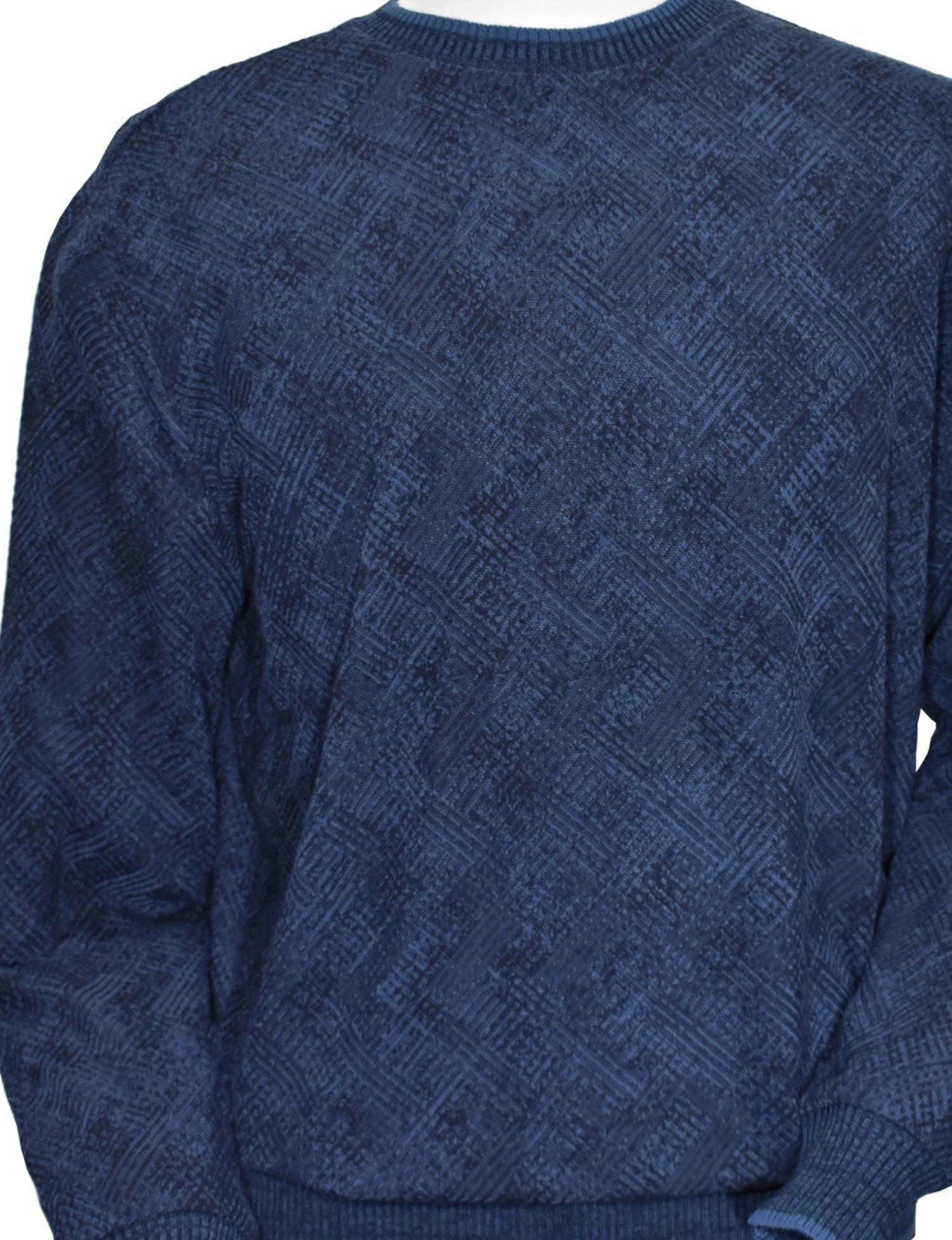 Image style in the Marcello Indigo Diagonal Jacquard Sweater - a perfect blend of cotton, viscose, and microfiber that creates a lightweight, soft knit for ultimate comfort and stretch. Its sophisticated indigo and navy tones and shaded highlights, along with a stylish abstract diagonal pattern, will elevate any outfit. A clean and stylish image to pair with jeans or pants.