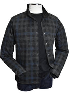 Introducing the Marcello Terrio Button Front Shacket, the perfect combination of style and functionality. This shirt jacket features a classic mock collar and snap enclosure, along with open sleeve cuffs and a waist band for a comfortable fit. The rich black base color is accented with a charcoal plaid pattern and a pop of royal blue.