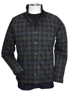 Introducing the Marcello Terrio Button Front Shacket, the perfect combination of style and functionality. This shirt jacket features a classic mock collar and snap enclosure, along with open sleeve cuffs and a waist band for a comfortable fit. The rich black base color is accented with a charcoal plaid pattern and a pop of royal blue.