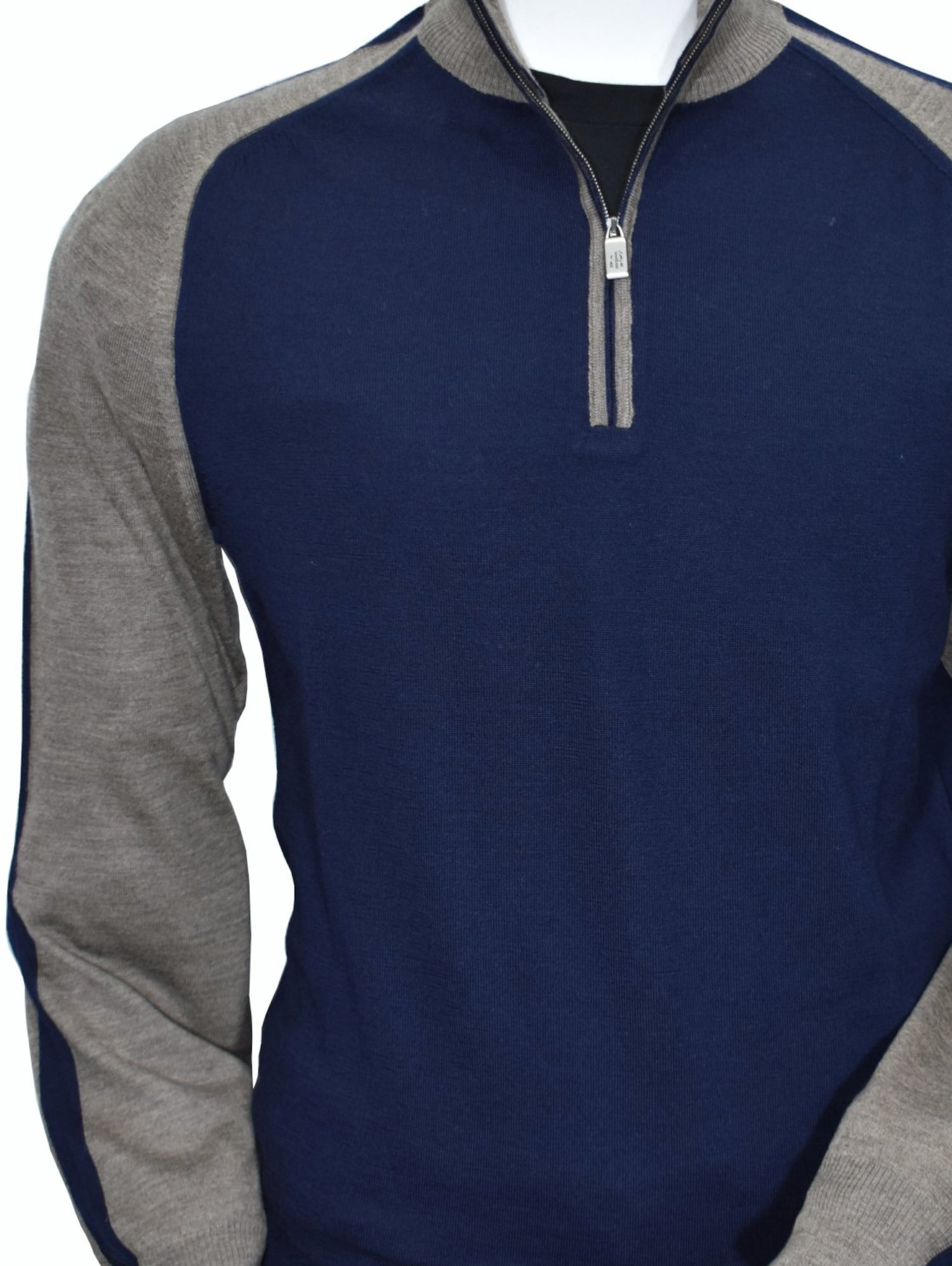 Upgrade your wardrobe with Marcello's 914 Amalfi Collection Mocha Navy-Taupe engineered quarter zip. Designed by our Unica Milano team, this Italian-made quarter zip is made from a luxurious merino wool blend that is lightweight, soft, and sophisticated. The engineered model features a contrast effect for a touch of timeless style. Elevate your fashion game with this classic piece.