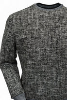 This classic crew neck sweater features a rich combination of tan, ivory, and black, making it the perfect addition to any outfit in the black or tan families. 
