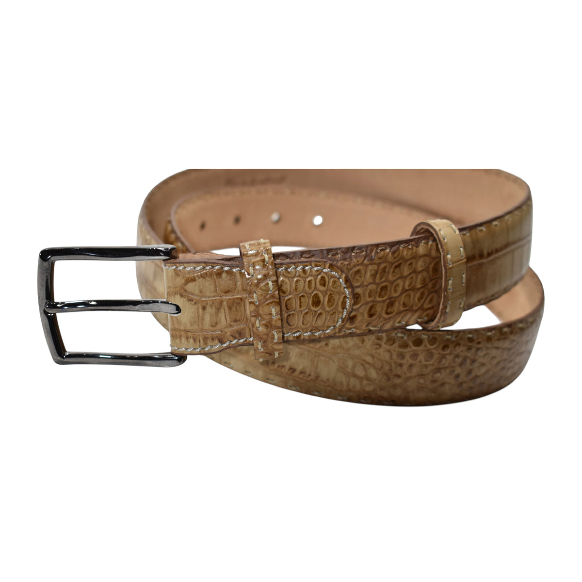 A Marcello tan leather belt with a crocodile-embossed texture and a silver-tone metal buckle, coiled on a plain white background.