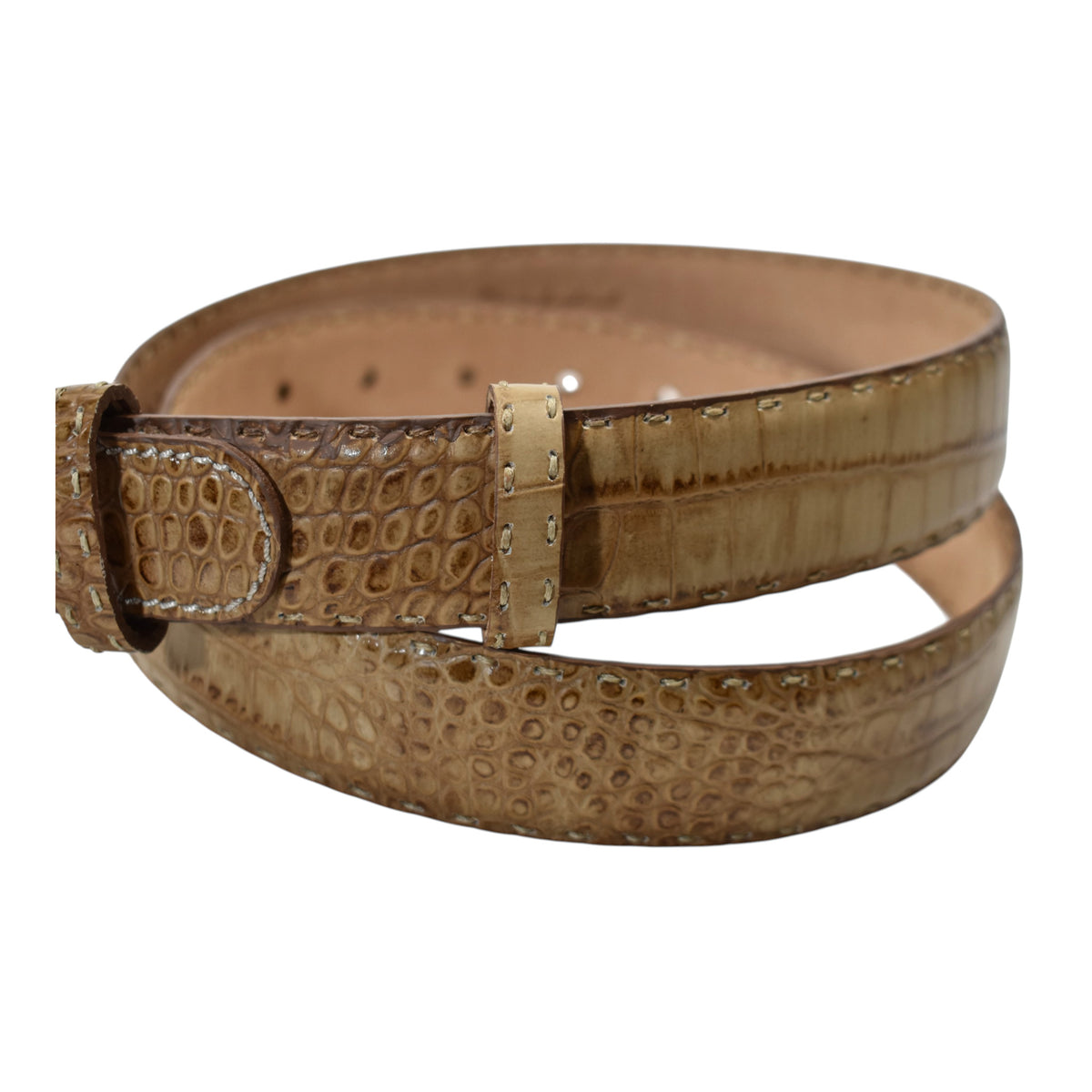 A Marcello tan leather belt with a crocodile-embossed texture and a silver-tone metal buckle, coiled on a plain white background.