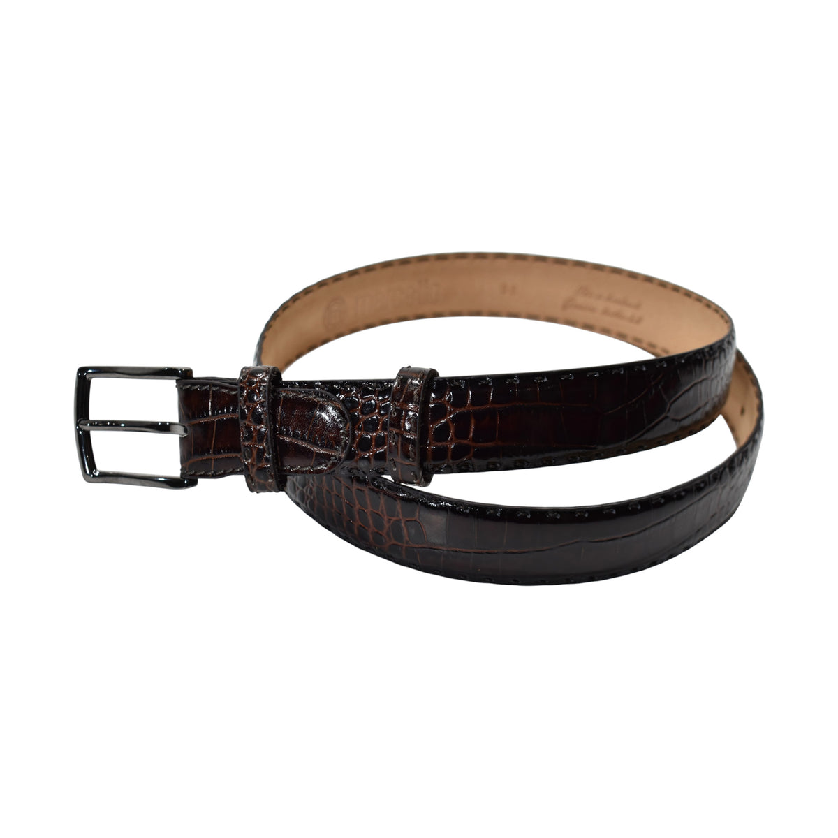 A Marcello dark brown crocodile-embossed leather belt with a black metal buckle, coiled on a plain white background.