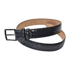 A Marcello charcoal crocodile-embossed leather belt with a silver-tone metal buckle, coiled on a solid white background.