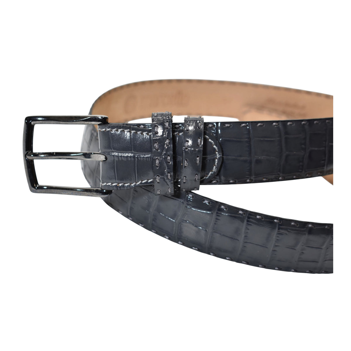 A Marcello charcoal crocodile-embossed leather belt with a silver-tone metal buckle, coiled on a solid white background.
