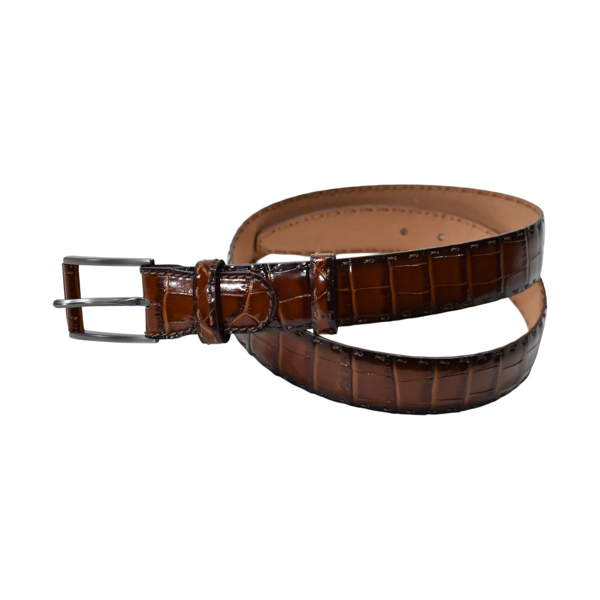 A Marcello Mocha Brown crocodile-embossed leather belt with a silver-tone metal buckle, coiled on a plain white background.