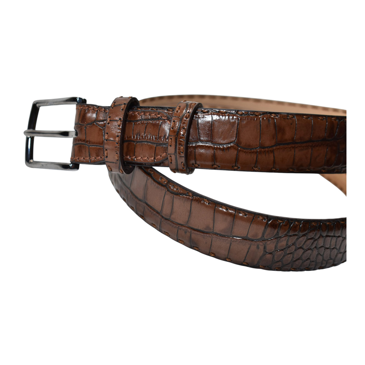A Marcello Mocha Brown crocodile-embossed leather belt with a silver-tone metal buckle, coiled on a plain white background.