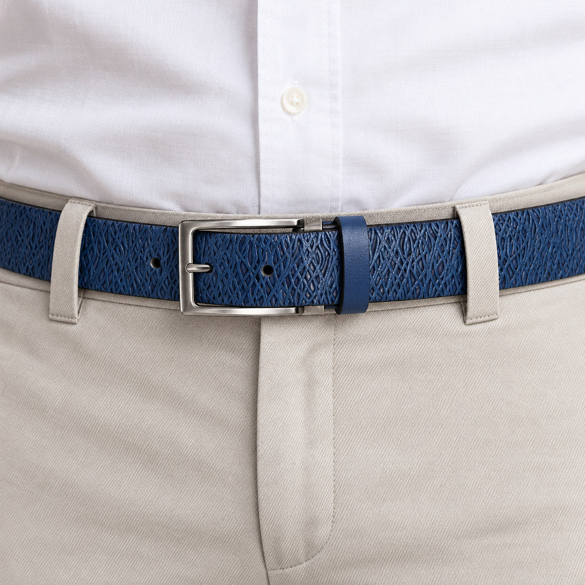 Marcello soft leather belt, uniquely stamped to look like an abstract weave, is subtle yet very stylish.   Brushed nickel buckle.  Sizes 32 -40  Colors: Brown or Indigo