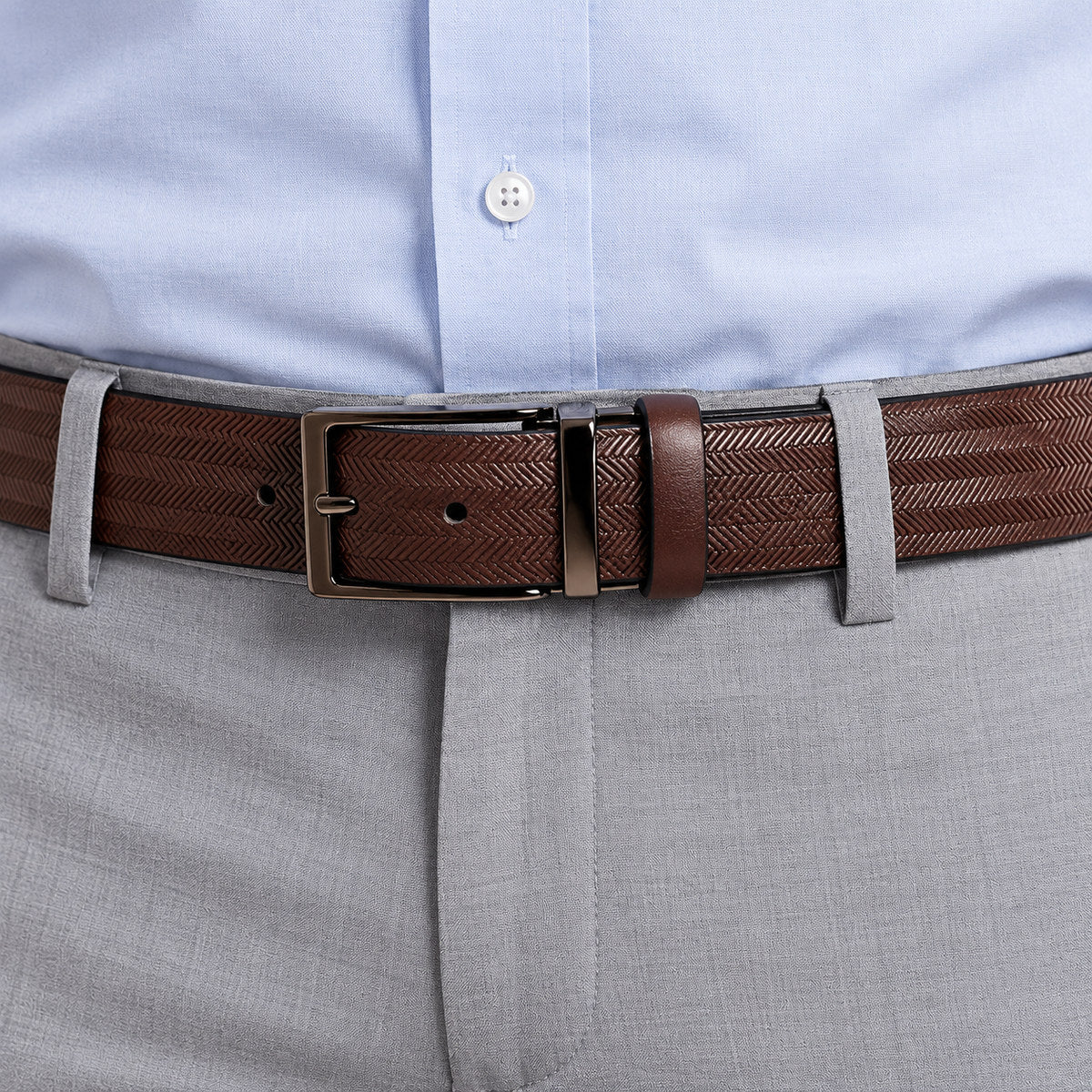 The always rich and elegant herringbone pattern is taken to another level when stamped on classic, soft leather to create a timeless look.  Brushed nickel buckle.  Sizes 32 to 44  Color is brown.