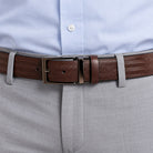 The always rich and elegant herringbone pattern is taken to another level when stamped on classic, soft leather to create a timeless look.  Brushed nickel buckle.  Sizes 32 to 44  Color is brown.