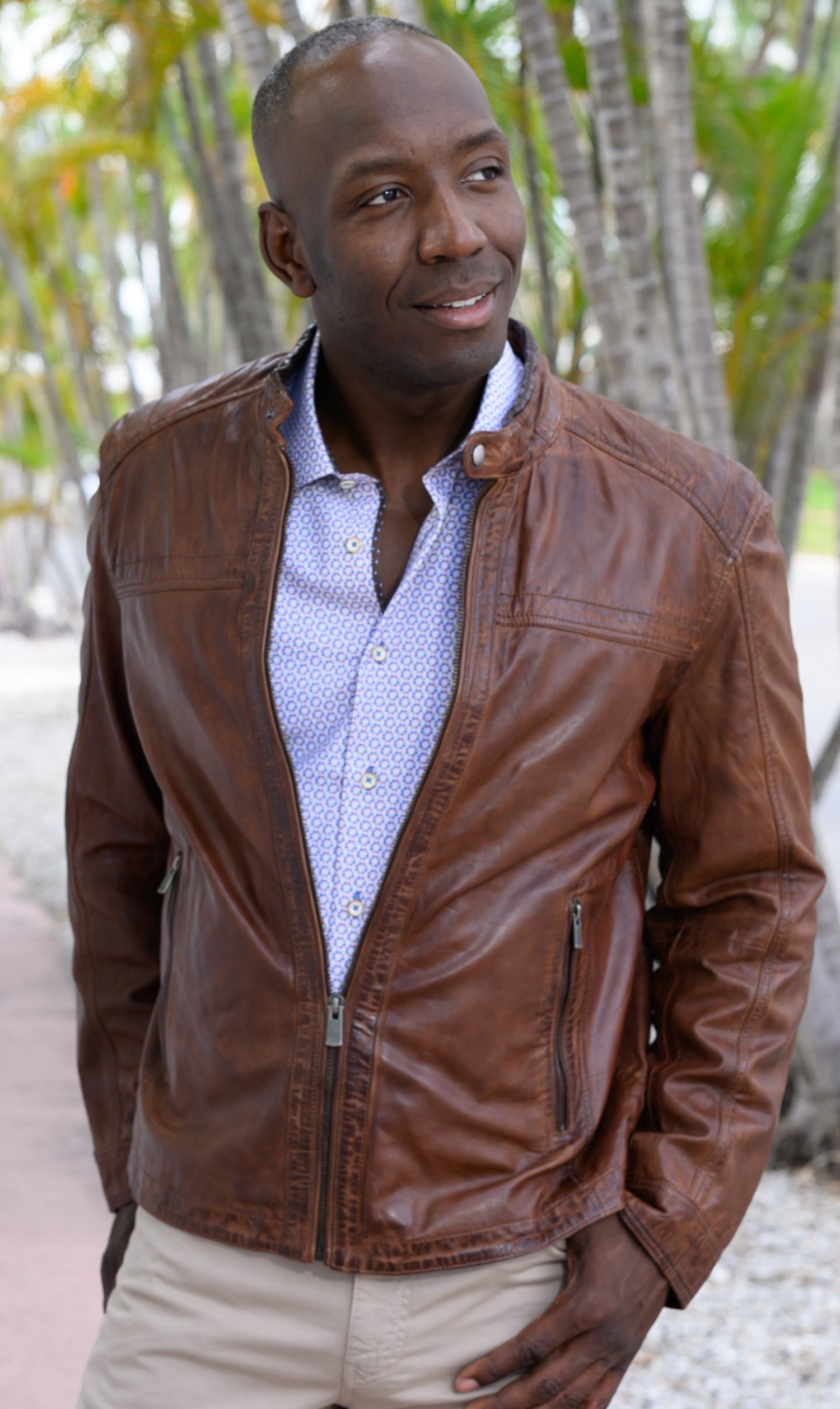 Look smart wearing this tobacco-colored leather bomber jacket. Crafted from soft, washed leather, this classic piece features cool stand-up baseball-style collar, cross-stitch shoulder detailing and open sleeves and bottom for a timeless look. Soft-lined with classic pockets, this bomber jacket offers a classic fit and feel.