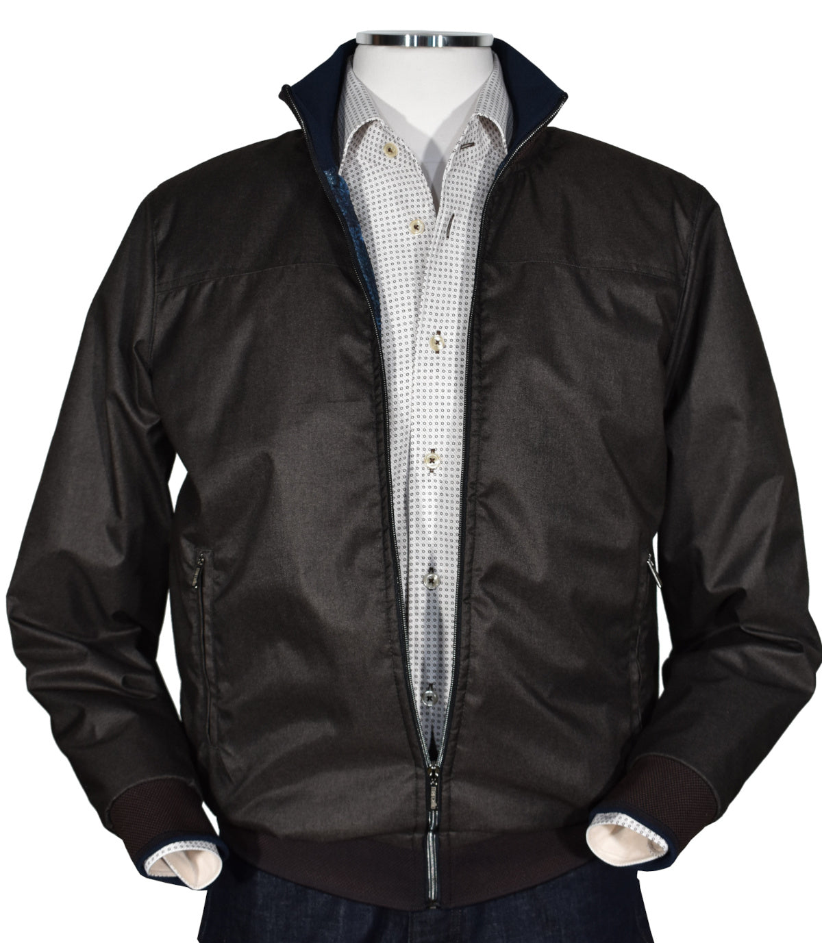 Elevate your look with the luxurious J413 Mocha Microfiber Bomber. Featuring a style and sophistication rarely found, this regal bomber is made from a lightweight microfiber fabric with a rich melange look, plus fashion-forward neck band, cuffs and waist band enhancements and a cool royal blue printed lining. Designed to fit a slim to medium build, this bomber is sure to make you stand out in a crowd.  Classic fit and classic banded cuffs and waist band.