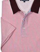 This ultra soft cotton pique polo looks timeless and feels lightweight. Its fine red ruby neat box pattern, contrast trim fabric, open sleeves and custom buttons make it unique and stylish. Enjoy its classic fit and timeless look.