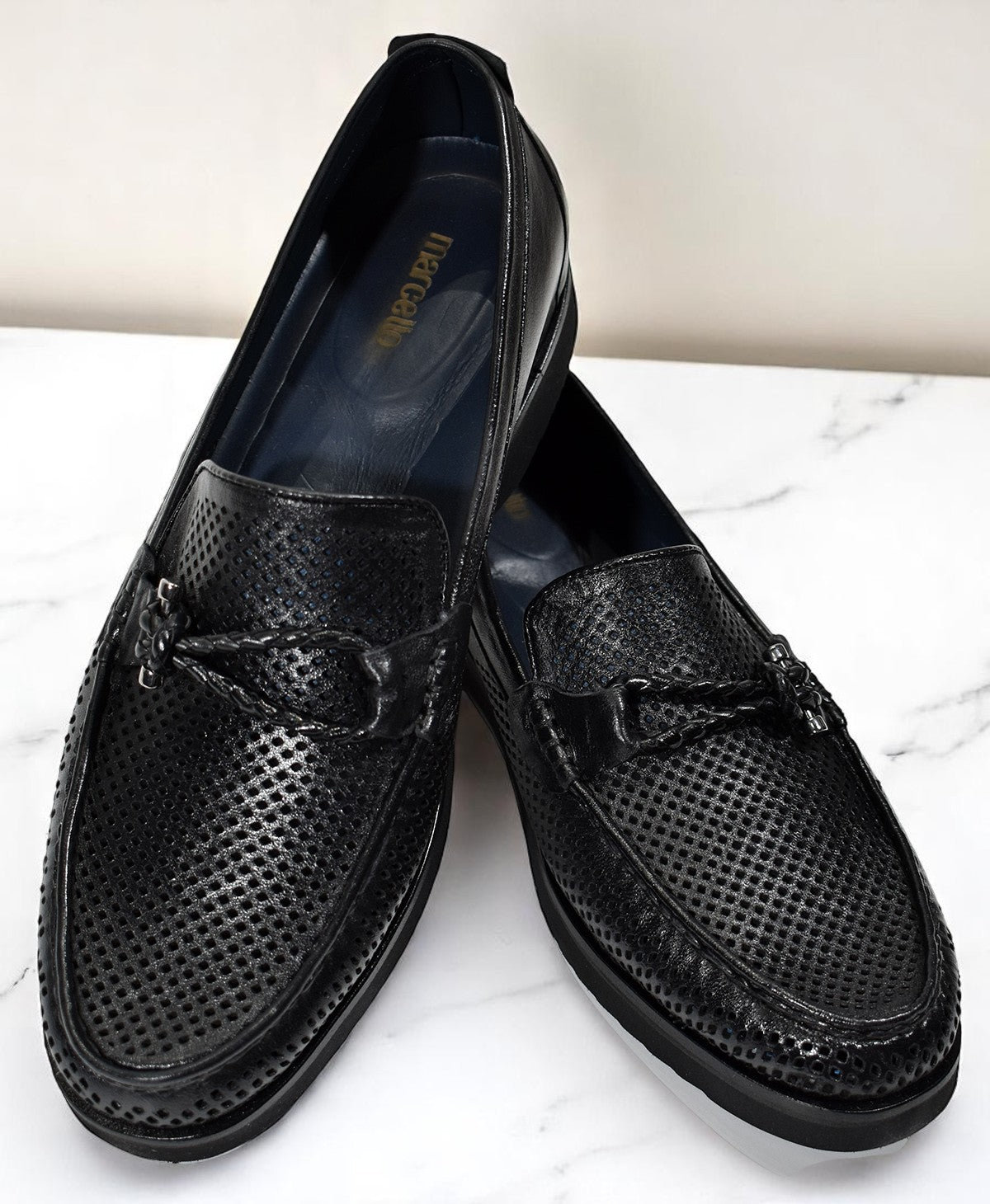 Elevate your style with our S002 Black Leather Perforated loafers.