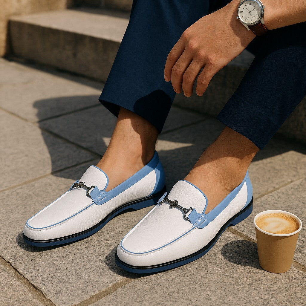 Elevate your casual style with these stunning white leather loafers featuring sophisticated blue trim.