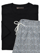 Marcello black t-shirt with 'Marcello' label and patterned swim short on a white background.