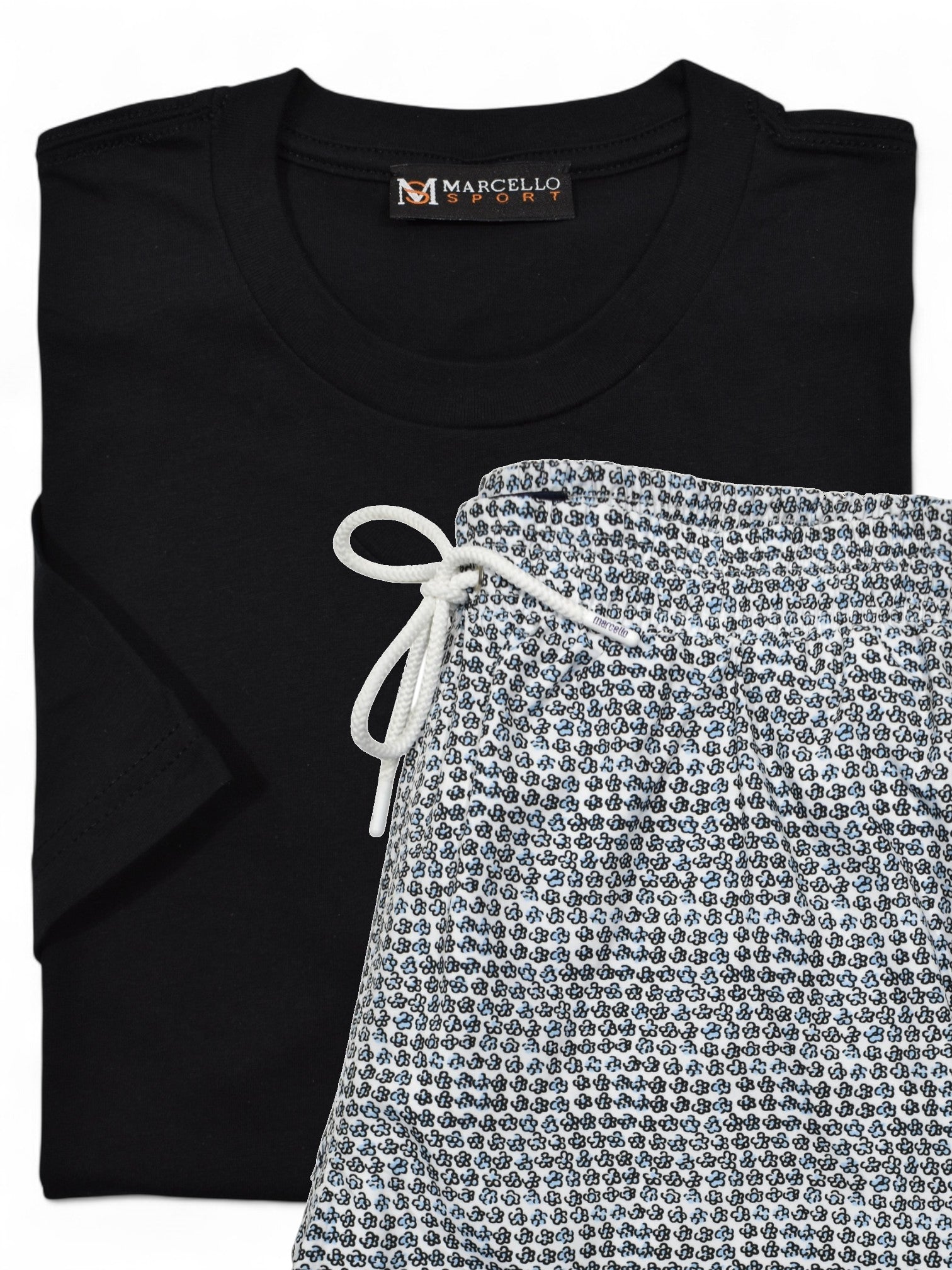 Marcello black t-shirt with 'Marcello' label and patterned swim short on a white background.