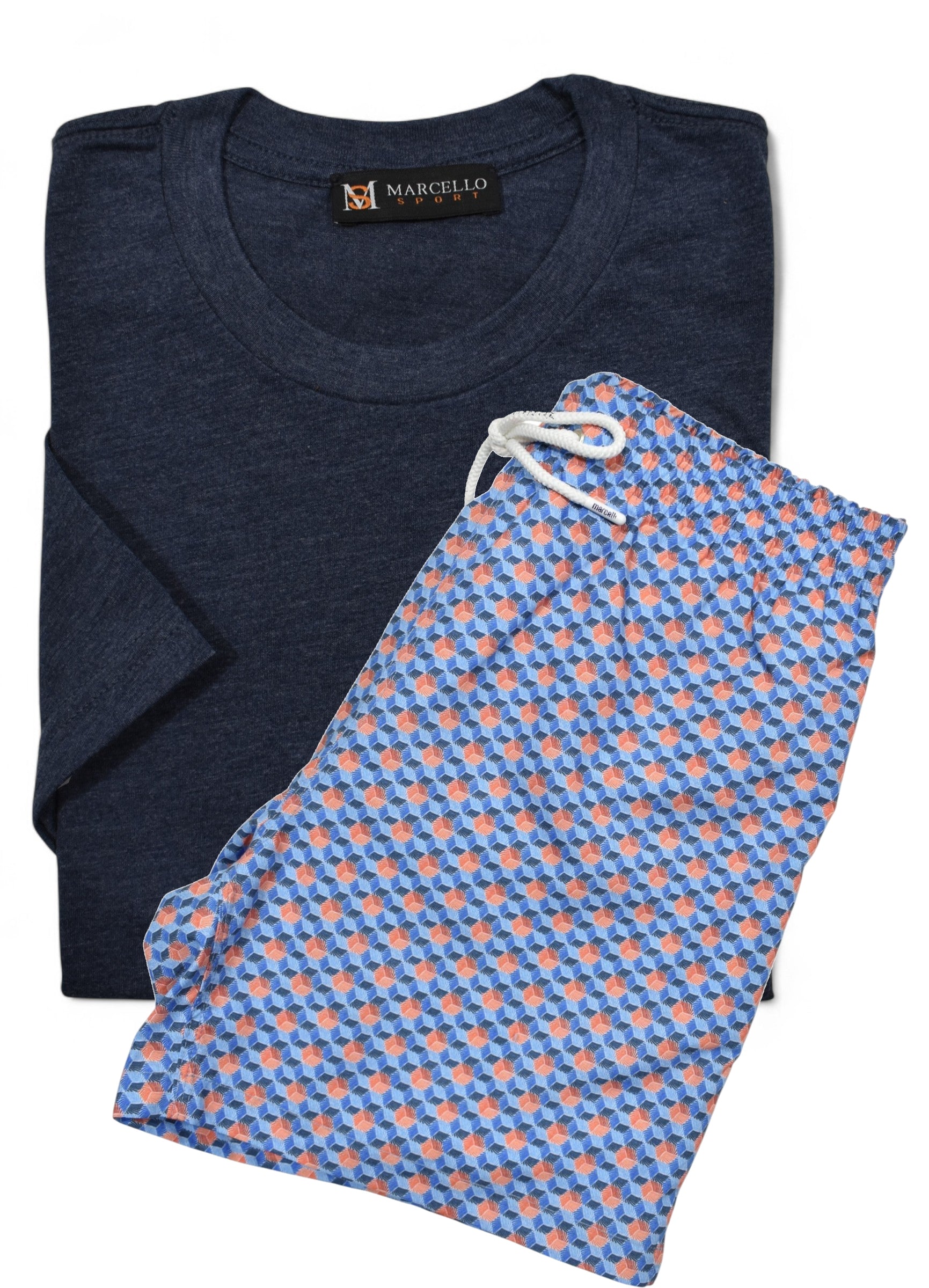 Marcello folded indigo t-shirt and blue patterned swim short with a visible brand label on a white background