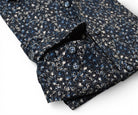 Marcello black floral with accent colors in tan and blue.