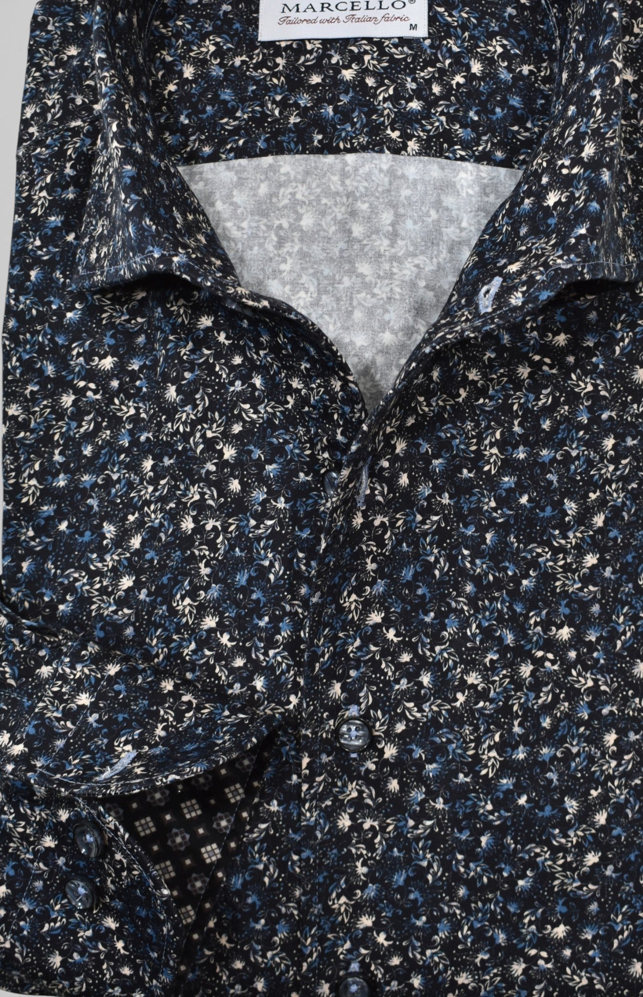 Marcello black floral with accent colors in tan and blue.