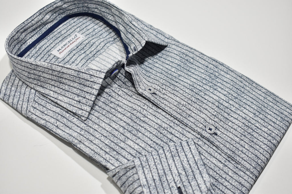 A double stripe atop an abstract static print gives you a fashionable look without going too far. Style it with any denim and you'll be good to go! Boasting a medium-sized collar and a classic shape, this shirt is made with a soft cotton fabric and custom buttons, plus an extra cuff button for a touch of detail.