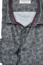 This island motif shirt features an elegant and contemporary design, crafted from a luxurious blend of cotton and microfiber for a silk-like feel. A soft gray-smoked pattern with charcoal to black foliage creates a timeless look. Custom-matched buttons, red neck taping, and a classic shaped fit complete the design. by Marcello