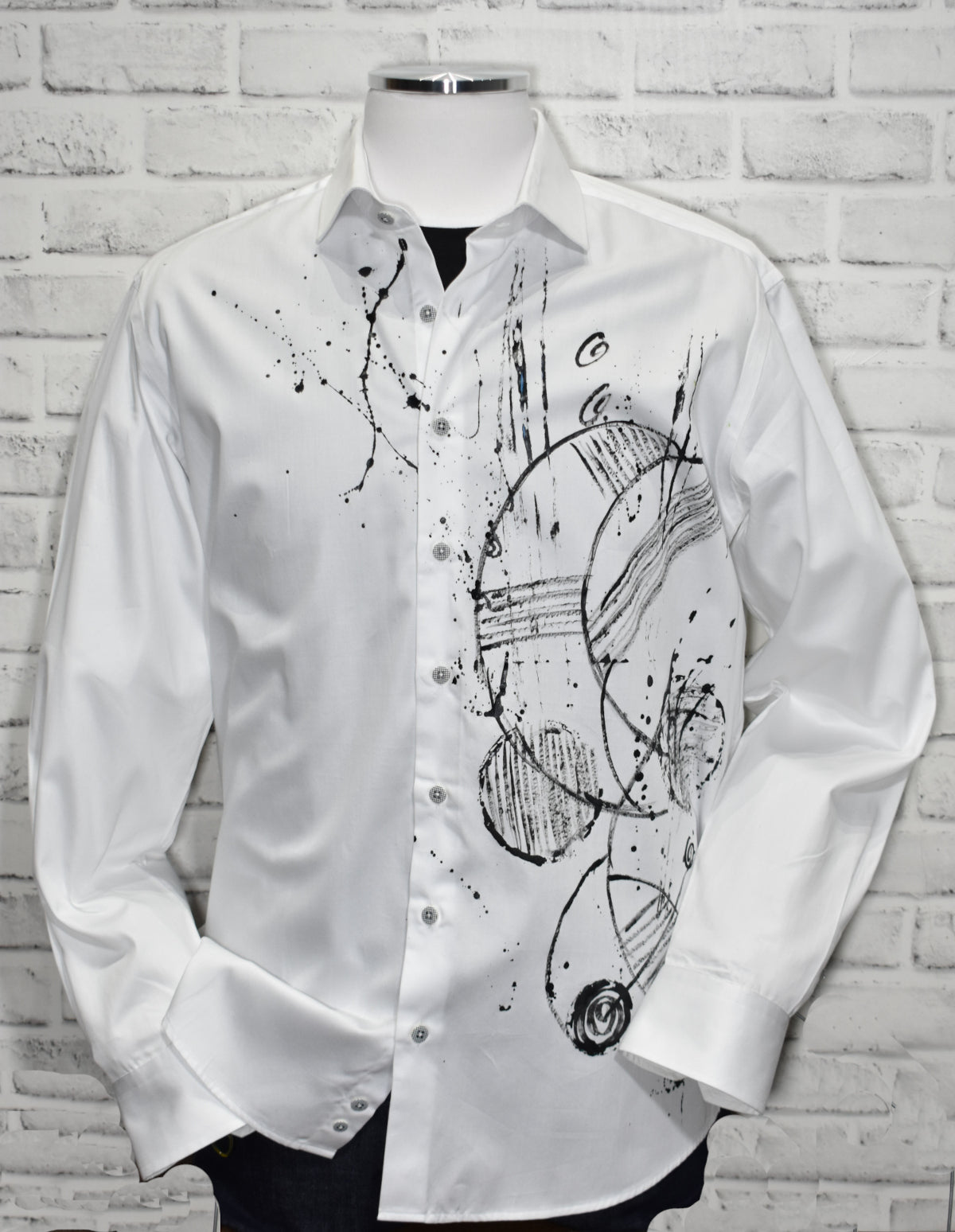Experience luxe style with the Shades of Black Hand Painted shirt! Crafted with rich white cotton sateen fabric and featuring a custom hand painted abstract geometric pattern, this shirt stands out from the rest. With a classic shaped fit for a timeless look, this unique design is an exclusive to Marcello.