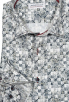 This W791 Slate Brushed Grid shirt is exquisitely designed for a sophisticated look. Crafted from rich cotton sateen and featuring custom buttons, contrast stitch color and taping, it adds the perfect touch of elegance to any outfit. Enjoy the luxurious feel and modern design of this classic shaped fit. By Marcello