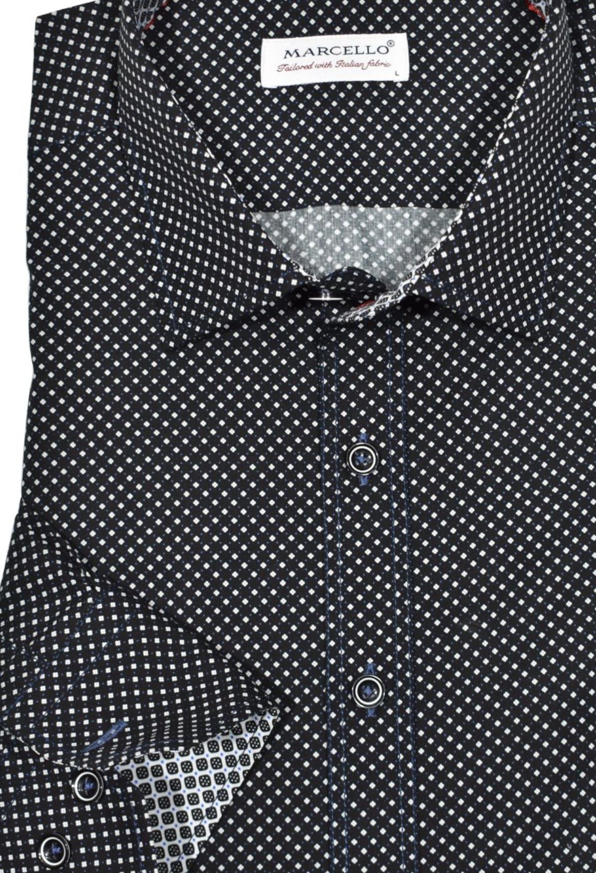 Bring sophistication and style to your wardrobe with our Marcello Midnight Roll Collar. Crafted from soft cotton for an ultra-luxe feel, the unique roll collar stands perfect and looks great alone or under a sport coat. Timeless white and royal dot pattern over a black ground. Elevate your look with contrast royal stitching, custom buttons and matched trim fabric.