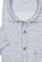 Stay cool and stylish in the W824S White Floral Seersucker shirt. Made from lightweight, seersucker fabric, this short-sleeved model comes in crisp white with a trendy navy flower pattern. Contrast navy stitching and a classic chest pocket provide the perfect trendy touch, while custom-matched buttons keep you looking sharp. Seersucker Marcello Shirt.