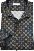 The Marcello W870 Blooming Medallion, a luxurious addition to your sport shirt collection. Made with soft cotton sateen fabric, this shirt boasts a rich chocolate ground and a beautiful floral medallion design. The Marcello one piece roll collar adds a unique touch, making it stand out from the rest.  Cotton sateen fabric.