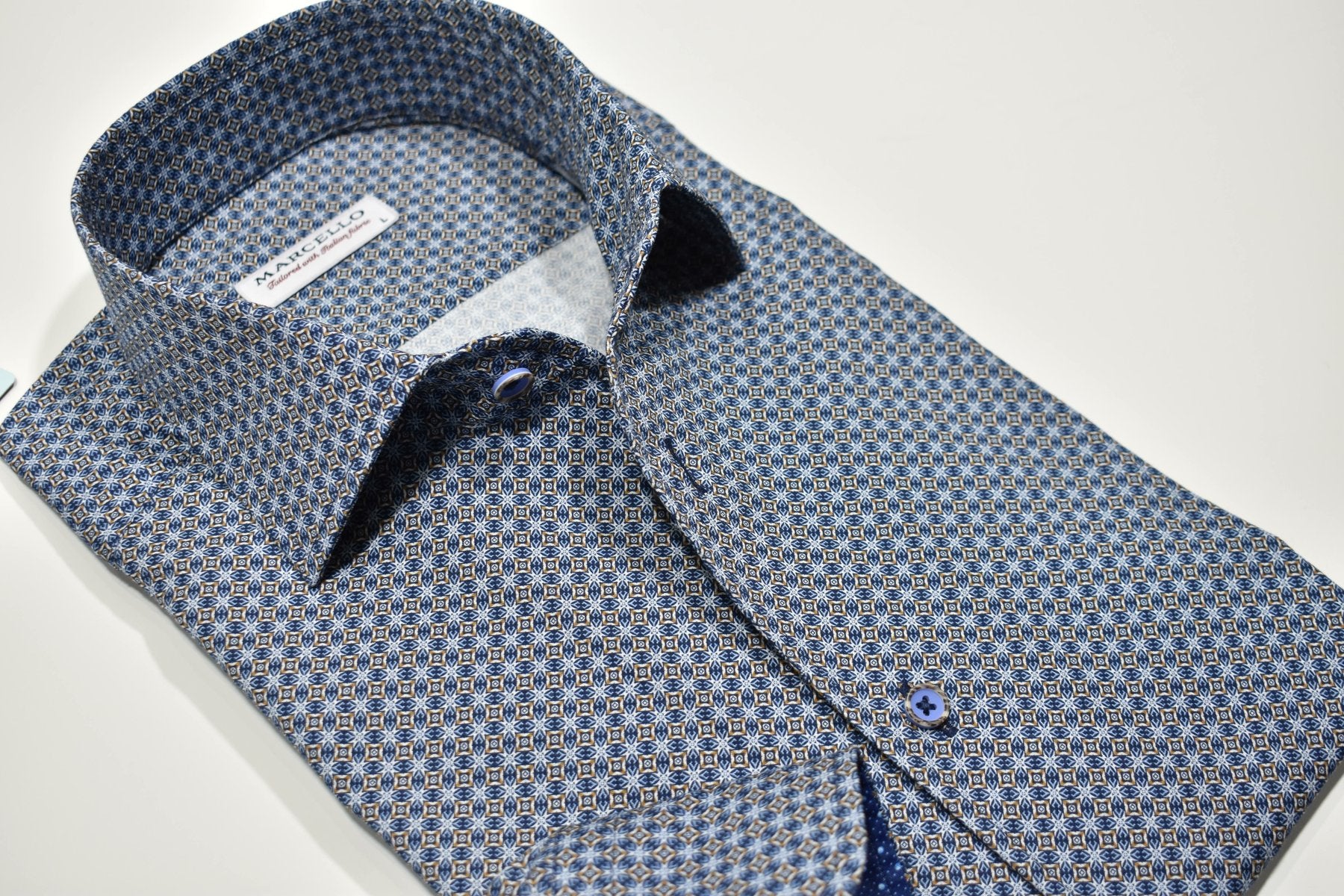 Elevate your traditional style with the W871 Slate Diamond Burst shirt. The Marcello roll collar adds a modern touch, while the soft cotton sateen and classic diamond burst pattern provide an exceptional look and style. Upgrade your wardrobe with this industry best design.