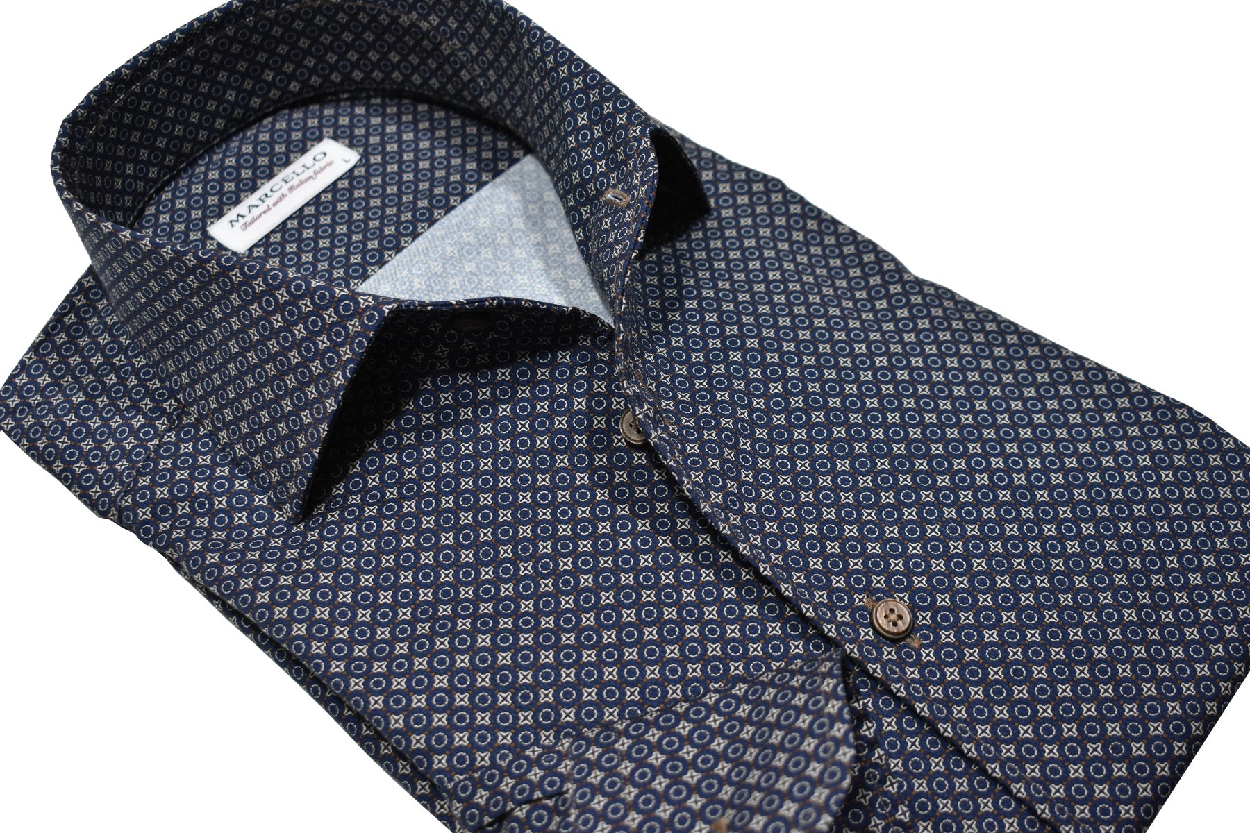 Upgrade your wardrobe with the rich Venice Elegance shirt. The Marcello exclusive one piece roll collar pairs seamlessly with a true navy shirt, highlighted with camel and chocolate neat medallions. Perfect for a stylish and versatile Fall look.