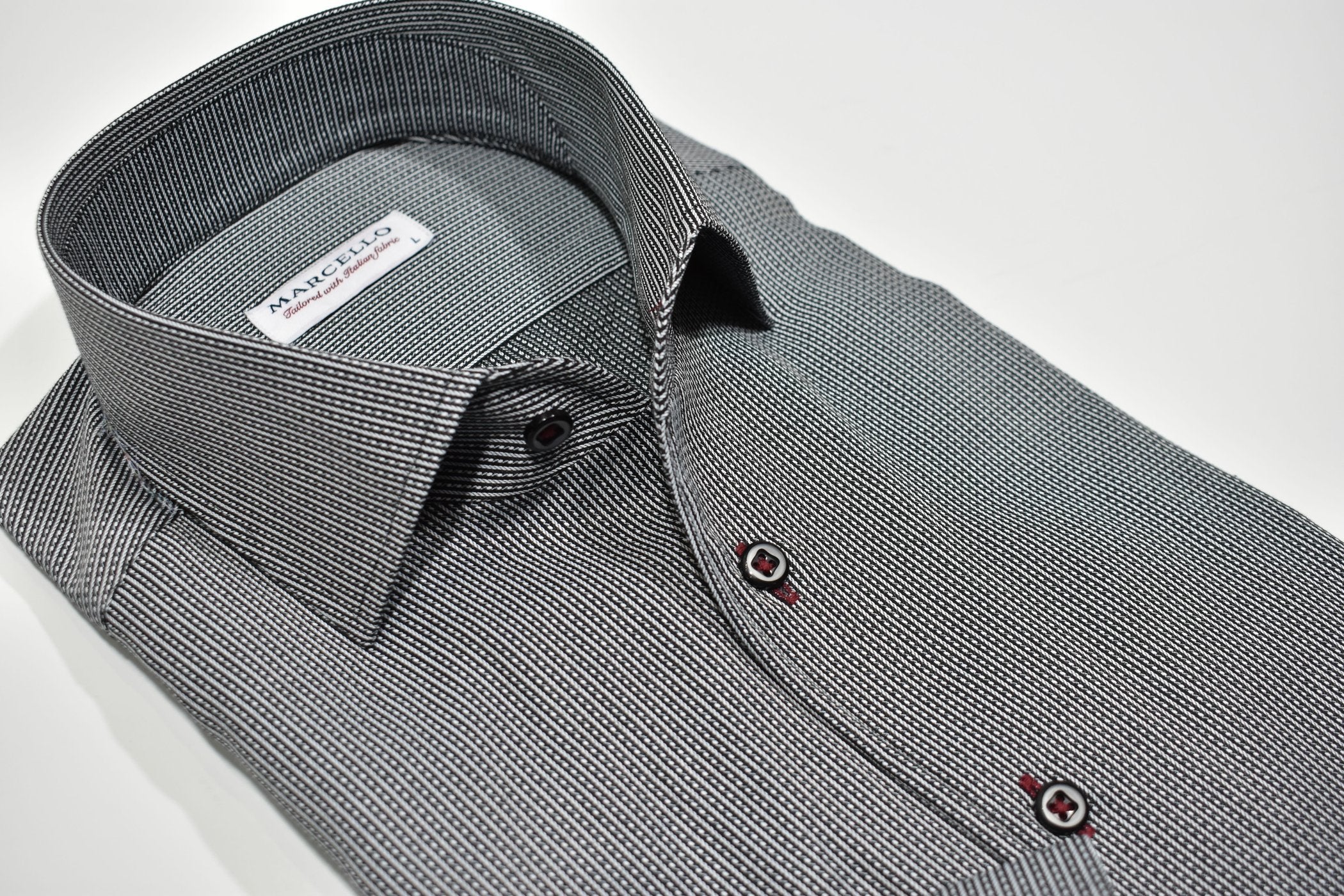 Elevate your style with the Marcello W939R Black Stripe Roll Collar. Featuring a Marcello exclusive one piece roll collar, this fine black shirt with a solid and dashed stripe is accented with custom details. Exude style and sophistication with this must-have piece.
