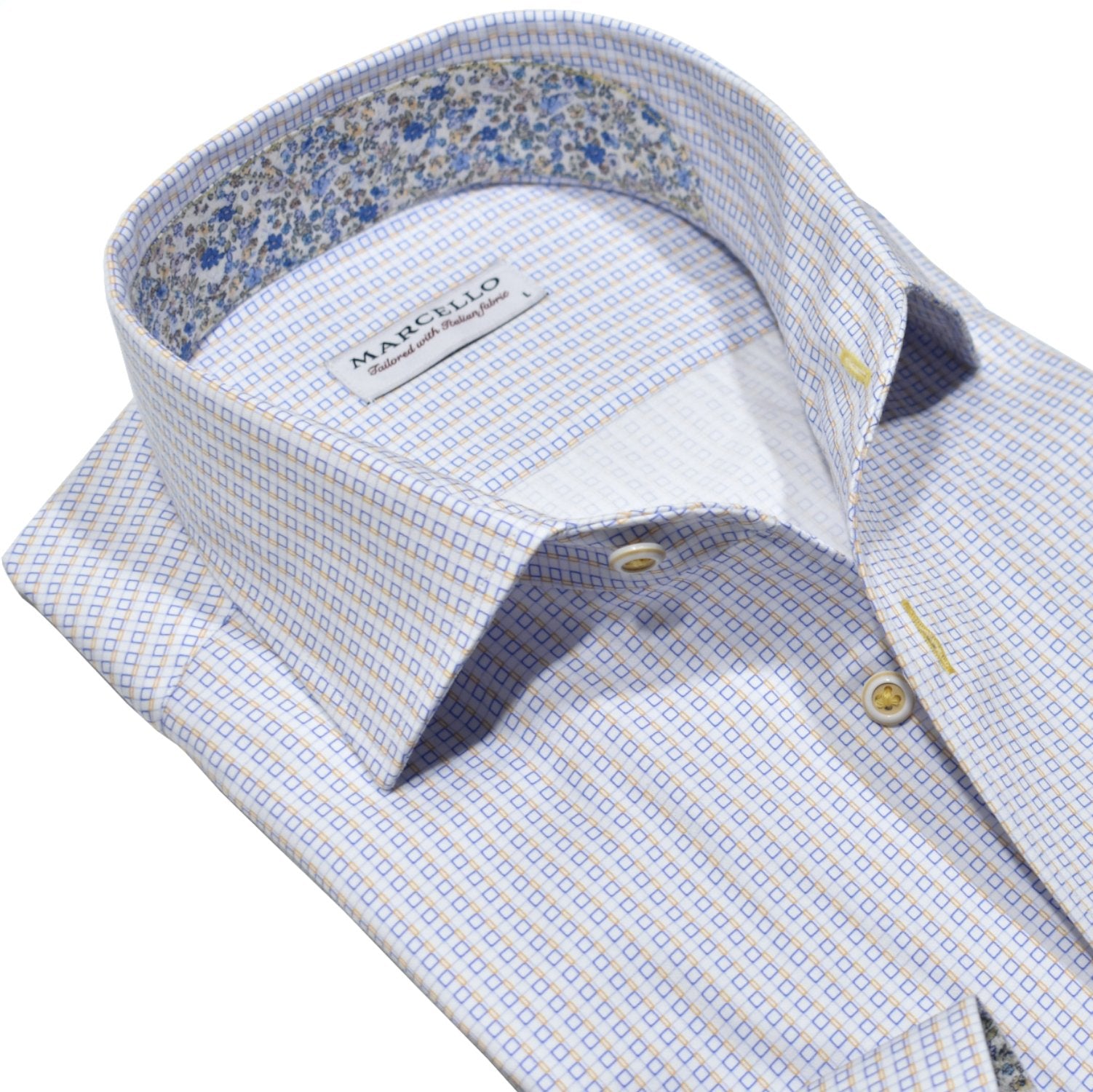 Upgrade your wardrobe with the Marcello Spring Check Roll Collar. Made from soft, high-quality cotton, this shirt features a unique soft blue and maize box geometric design on a classic white fabric. 