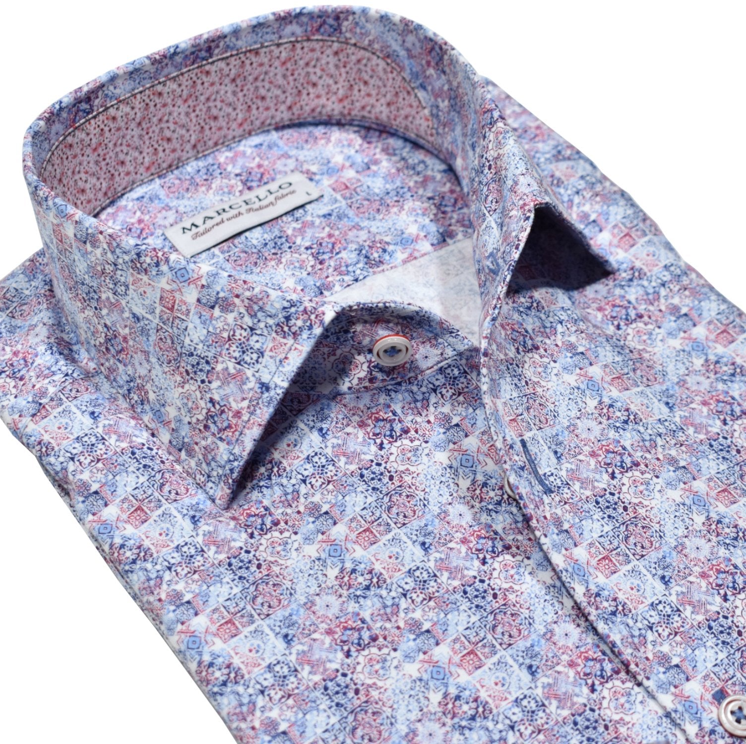 Experience ultimate comfort and style with the Marcello Spirit Madras Sport Shirt. Our exclusive one piece roll collar is designed for superior performance, while the soft cotton sateen fabric keeps you feeling cool and comfortable. The smart madras pattern adds a touch of sophistication, complete with custom buttons and trim fabric.