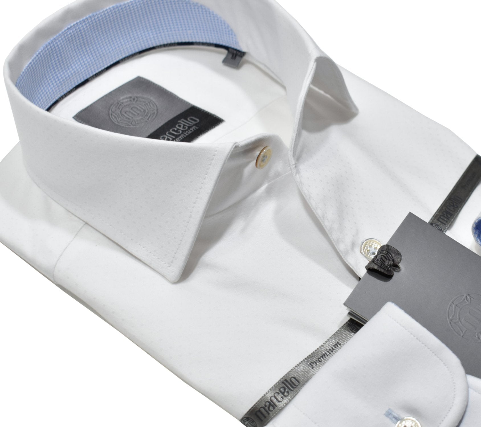 Elevate your wardrobe with the Marcello Premium Tonal White shirt. Crafted from extra fine fabrics sourced from fine Italian mills, our Marcello Premium program offers 100's 2 ply shirts in rich classic patterns. With the Marcello exclusive one piece roll collar, you'll feel confident and stylish in any setting.