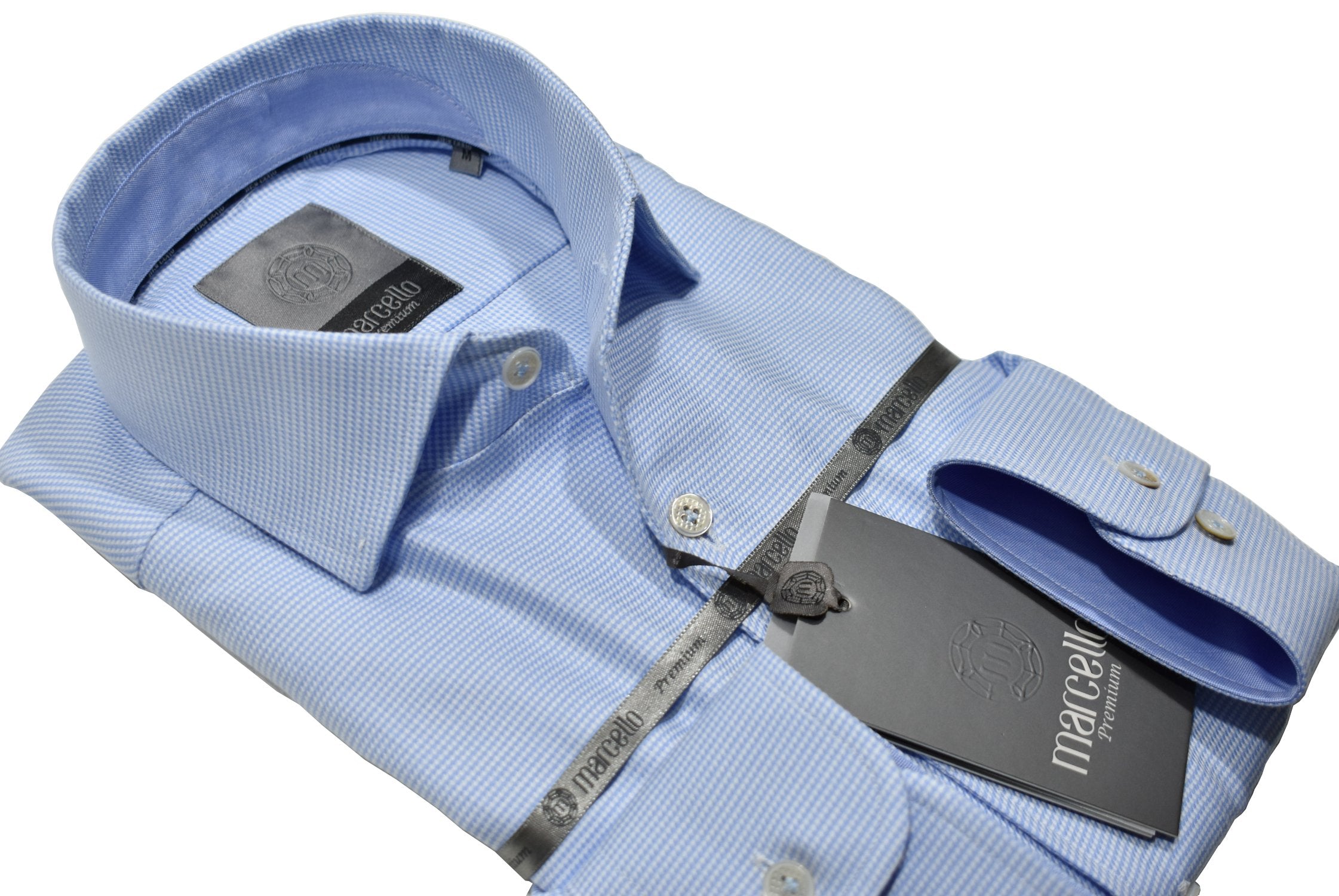 Elevate your wardrobe with the Marcello Premium Classic Blue Neat shirt. Crafted from extra fine fabrics sourced from fine Italian mills, our Marcello Premium program offers 100's 2 ply shirts in rich classic patterns. With the Marcello exclusive one piece roll collar, you'll feel confident and stylish in any setting.